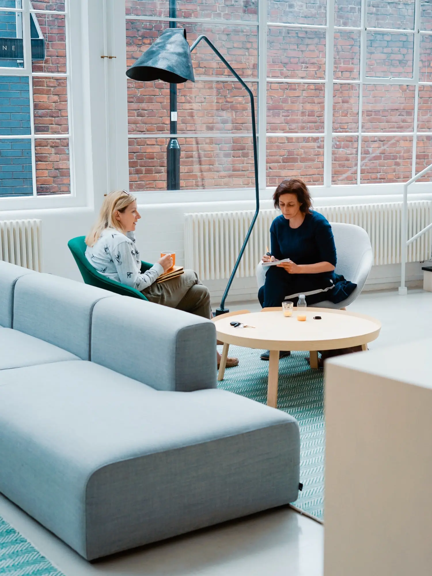 One-to-one coaching session in a calm, light-filled space